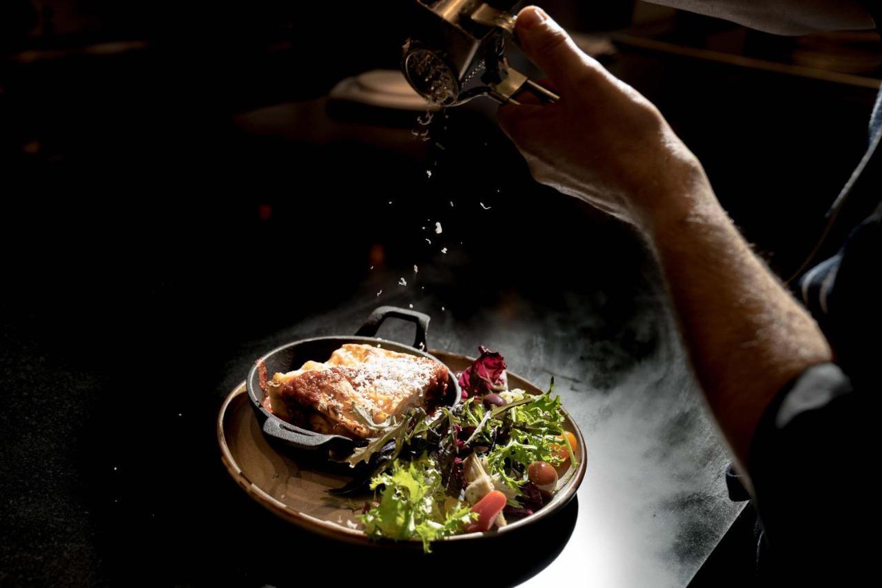 Peppers Waymouth Hotel Аделаида Экстерьер фото A chef seasoning a dish